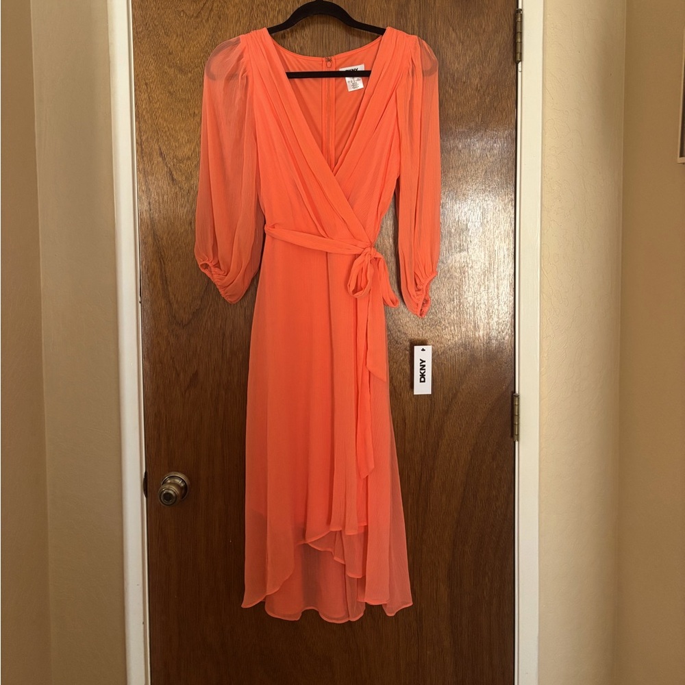 DKNY faux wrap dress. Fully lined. Slight snag pictured back.
